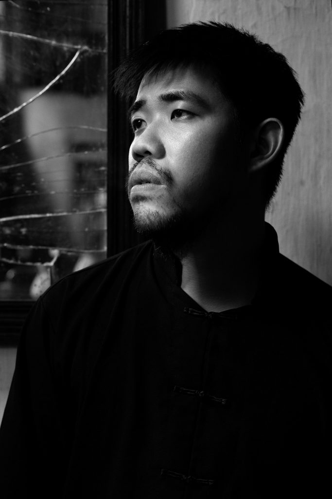Black and white portrait photo of young man 