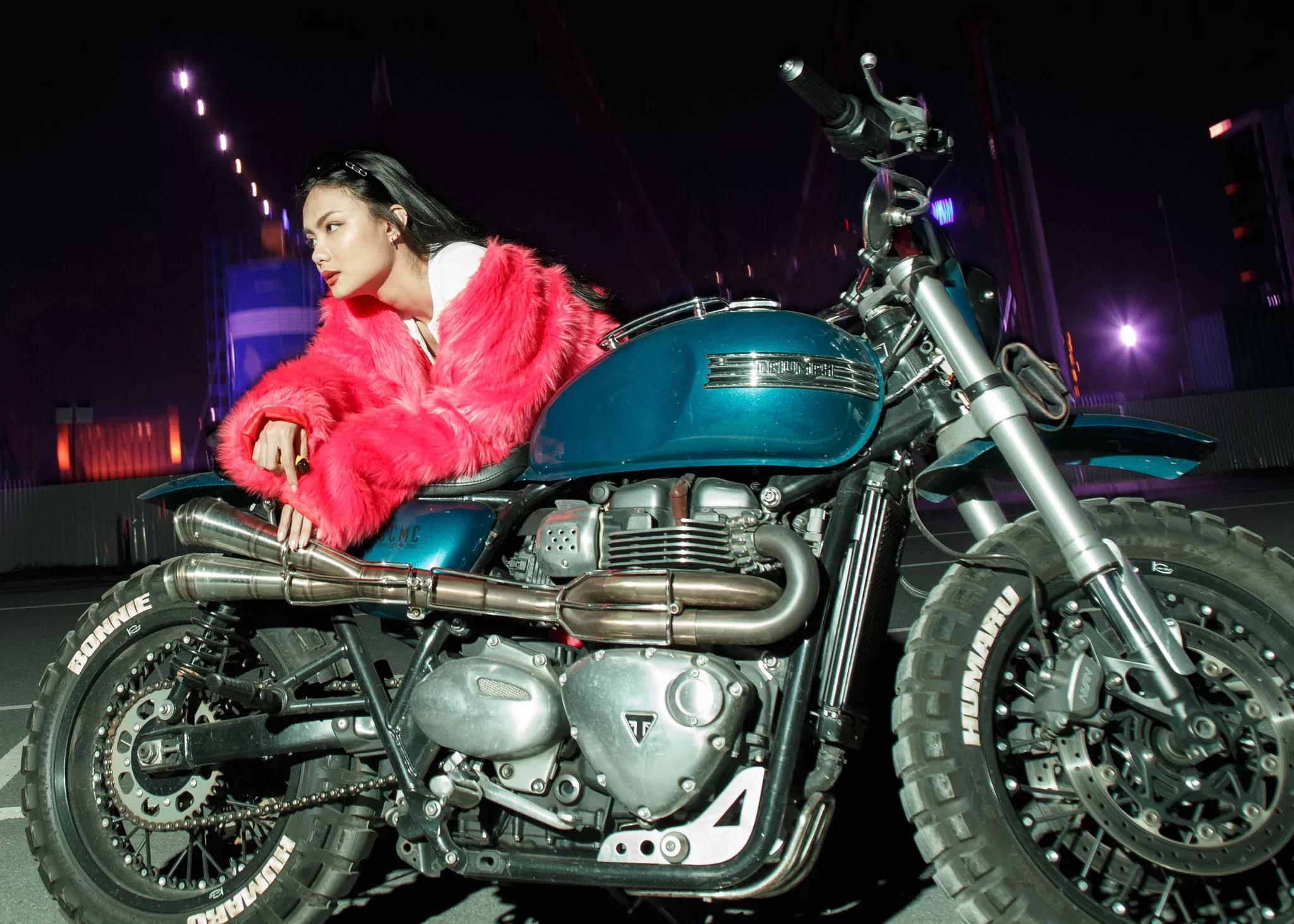 model on motobike in a fashion photoshoot
