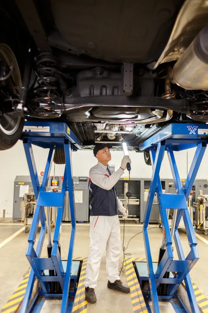technician doing car check in toyota workshop
