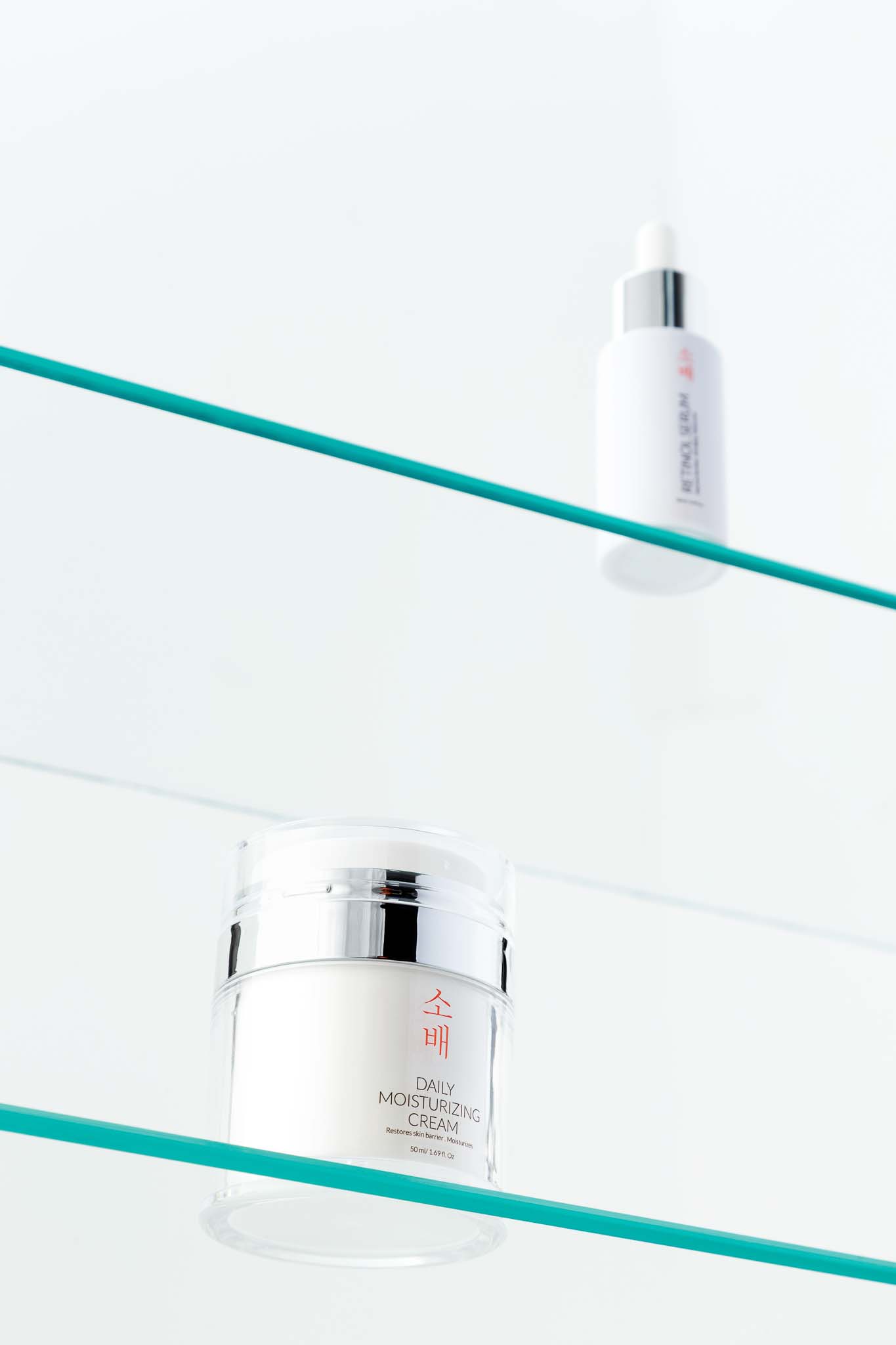 sobae cosmetic foam cleanser and cleansing balm on pieces of glass