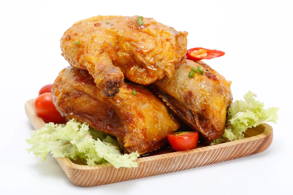 fried chicken in fish sauce glaze, Coop mart stock photography