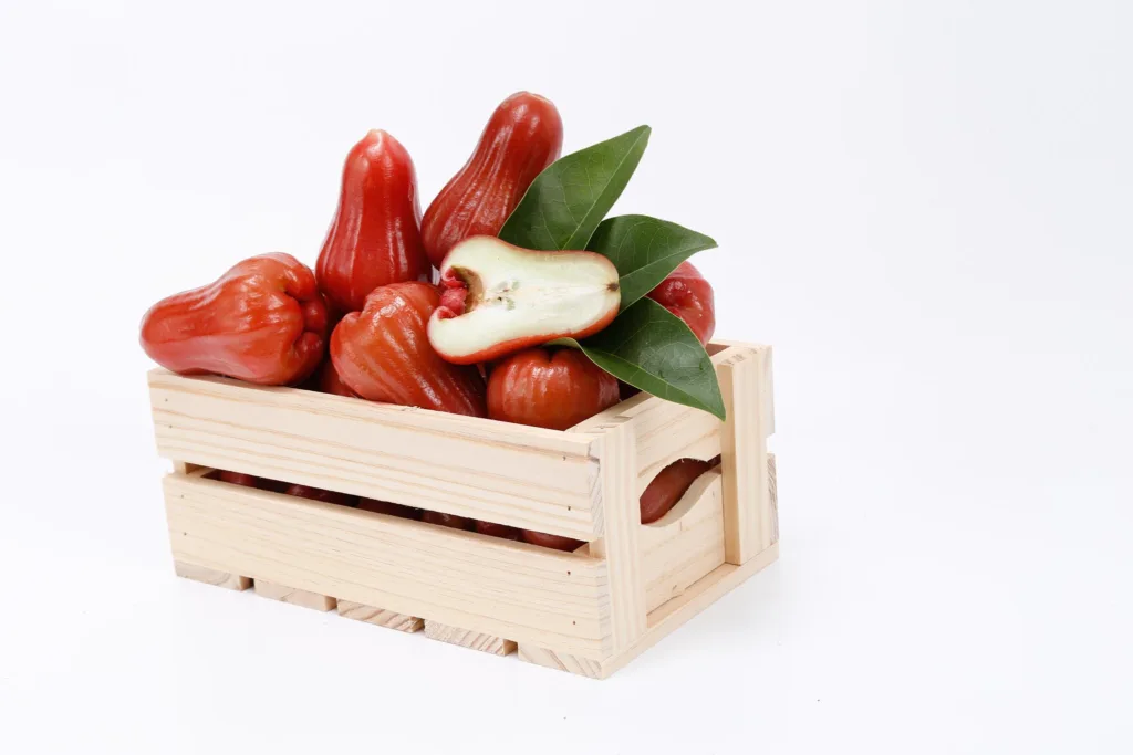 water apple on a white background, styled in stock photoshoot for Coop mart